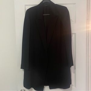 The Row boyfriend blazer. Peak-lapel, slit side pockets no buttons no vent.